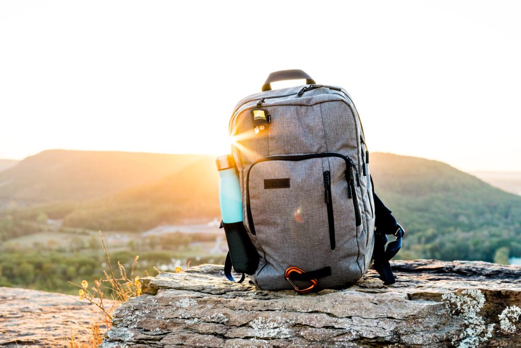 Photo of backpack on a rock by Josiah Weiss on Unsplash